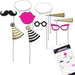 Set of photo booth props including mustache, lips, glasses, party hats, speech bubbles, and gold megaphones on sticks.