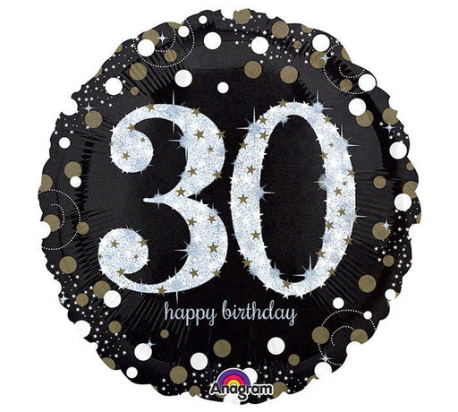 Round black foil balloon with large silver glitter-effect number '30' in the center, surrounded by gold and silver confetti dots, and the words 'happy birthday' in small white script below.