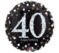 Round black foil balloon with large silver glitter-effect number '40' in the center, surrounded by gold and silver confetti dots, and the words 'happy birthday' in small white script below.