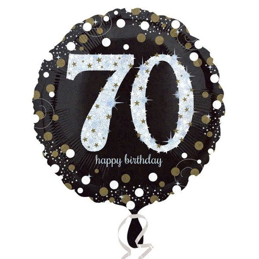 Round black foil balloon with large silver glitter-effect number '70' in the center, surrounded by gold and silver confetti dots, and the words 'happy birthday' in small white script below.