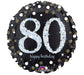 Round black balloon with large silver glitter number '80,' gold dots, and 'happy birthday' text in cursive at the bottom.