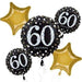 Arrangement of gold star-shaped balloons and black round balloons with white '60 happy birthday' text, decorated with white and gold dots.