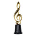 Gold treble clef-shaped trophy with a smooth metallic finish, mounted on a short round black base.