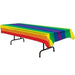Rectangular plastic table cover with horizontal rainbow stripes in red, orange, yellow, green, blue, and purple, draped over a rectangular table.