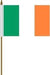 Rectangular flag with three vertical stripes: green on the left, white in the center, and orange on the right. The flag is mounted on a vertical gold pole with a white sleeve and a gold spear-shaped tip.