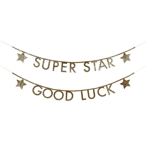 Gold glittery letter banner reading 'SUPER STAR' on the top strand and 'GOOD LUCK' on the bottom strand, each flanked by gold glitter stars.