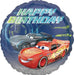 Round foil birthday balloon featuring Lightning McQueen and Jackson Storm from Disney Pixar’s Cars with 'Happy Birthday' text in bold lettering.