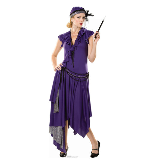 Cardboard cutout of a woman in a purple flapper costume, featuring an asymmetrical dress with ruffled sleeves, a headpiece with a feather, a long necklace, and black shoes. She holds a black cigarette holder in her right hand.