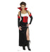 Cardboard cutout of a woman dressed in a vampire-themed costume, featuring a black and red dress with a high slit, white bust detail, dramatic red stand-up collar, black gloves, and black boots.
