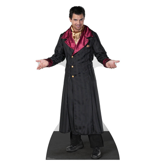 Cardboard cutout of a man wearing a long black coat with maroon satin lapels and cuffs, gold shirt, and black pants, posed with arms outstretched and a confident expression.
