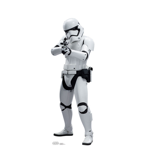 Cutout standee of a Star Wars First Order Stormtrooper in white armor with black detailing, holding a blaster in a ready position.