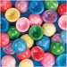 A mix of colorful plastic poppers in red, blue, green, yellow, pink, and purple with glossy domed surfaces, some flipped inside out, scattered on a blue background.