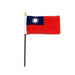 Rectangular flag with a red field and a blue rectangle in the upper left corner. Inside the blue area is a white sun with twelve triangular rays. The flag is mounted on a black pole with a white sleeve and a gold spear-shaped tip.