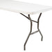  Rectangular stay-put tablecloth in white, securely fitted over a folding banquet table with metal legs, designed to prevent slipping during events or gatherings.