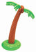 Inflatable palm tree with a curved brown trunk, green leaves, and coconuts near the top. The base is a green circular ring, allowing the tree to stand upright.
