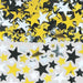 Assorted metallic star confetti in gold, silver, and black colors scattered across a surface. The stars vary in size and finish, creating a shiny, reflective effect.