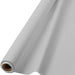 Silver plastic table cover roll partially unrolled, showing a smooth surface with slight folds and a cardboard tube core.