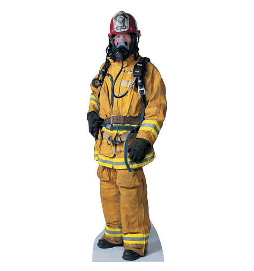 Cardboard cutout of a firefighter in full gear. The person is wearing a yellow fire-resistant suit with reflective yellow stripes, a red helmet with a badge, black gloves, and a breathing apparatus with a face mask and oxygen tank.