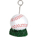 Baseball-themed balloon or card holder featuring a white baseball with red stitching resting on a green grass-like base, with a metal wire extending upward and ending in a circular clip for holding balloons, photos, or cards.