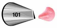 Metal piping tip labeled 101 with a narrow, curved opening, shown next to a soft pink icing petal shape with a slightly ruffled edge, demonstrating its use for creating delicate floral designs.