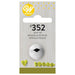 Wilton #352 leaf piping tip in retail packaging, featuring a metal decorating tip with a v-shaped opening, mounted on a light woodgrain card. The top of the packaging displays the yellow Wilton logo and product name in English, Spanish, and French. The bottom shows green icing leaf designs as examples of the tip's output.