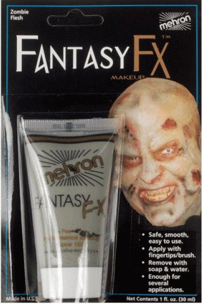 A packaged tube of Mehron Fantasy FX makeup in "Zombie Flesh" color. The packaging features an image of a person with realistic zombie makeup, showing decayed, pale, and wounded skin effects. The makeup is designed for easy application with fingers or a brush, is water washable, and provides enough product for multiple applications. Ideal for Halloween, costumes, or theatrical use.