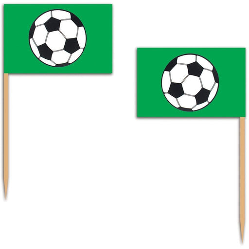 Soccer-themed food picks featuring small green flags with black and white soccer ball graphics, attached to wooden toothpicks. Ideal for decorating cupcakes, snacks, or party foods at soccer-themed events.