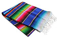 Folded Mexican serape blanket with colorful horizontal stripes in shades of blue, green, red, yellow, and pink, finished with white fringe on the ends.