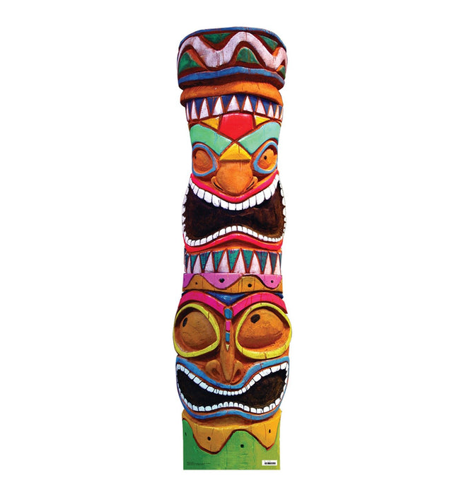 Colorful totem pole cutout featuring exaggerated facial expressions and intricate tribal-style carvings in vibrant hues of orange, red, green, yellow, pink, black, and white. The totem is divided into multiple stacked faces with bulging eyes, wide mouths, and sharp teeth, with the base anchored on a green platform. The white background emphasizes the pole's vivid design.