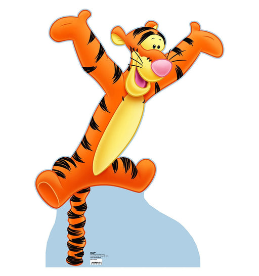 Cardboard cutout of Tigger from Winnie the Pooh, mid-bounce with arms spread wide and a joyful expression. His body is bright orange with bold black stripes along his arms, legs, tail, and back. His pale yellow belly and face contrast with his vibrant colors. Tigger’s pink nose and wide smile add to his animated personality. He is standing on his coiled spring-like tail, which serves as his base against a white background with a soft blue shadow beneath.