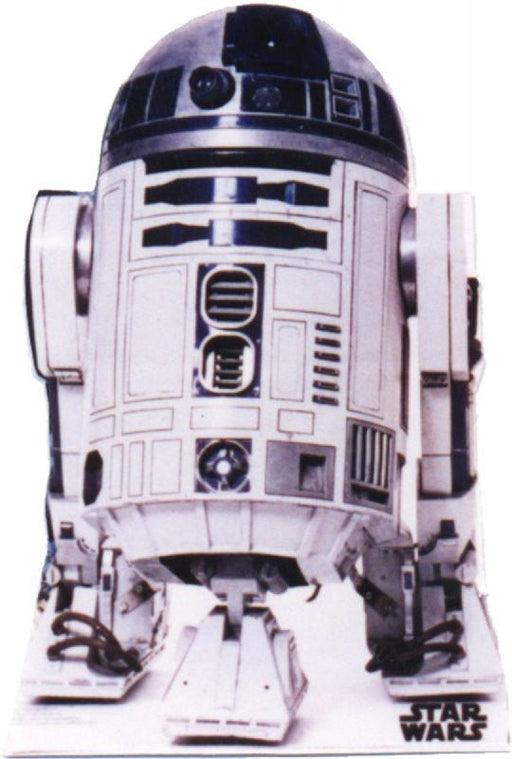 Life-size cardboard cutout of a white and blue astromech droid with a dome-shaped head, cylindrical body, and three-legged stance, featuring the Star Wars logo at the base.
