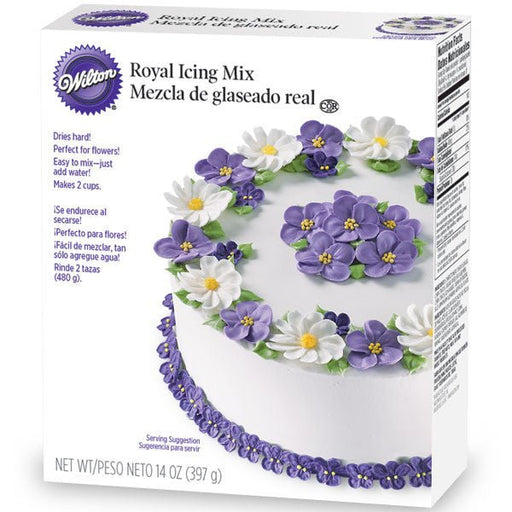 14 oz box of Wilton Royal Icing Mix, featuring an image of a white cake decorated with purple and white royal icing flowers. The packaging highlights that the mix dries hard, is ideal for flowers, and only requires water to prepare.
