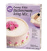 Box of Wilton Creamy White Buttercream Icing Mix with light purple packaging, showing a white frosted cake decorated with pink rose flowers, and a mixing bowl with a spatula.