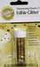 Wilton Shimmering Hearts Edible Glitter in a clear plastic jar with a white screw-on lid, packaged on a gold and white backing card decorated with black heart accents and multilingual text.