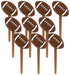 Set of brown football-shaped party picks with white laces, arranged in a scattered standing pattern.