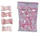 Bag of Party Sweets brand pink polka dot wrapped candies, shown alongside four individual unwrapped pieces displayed vertically.