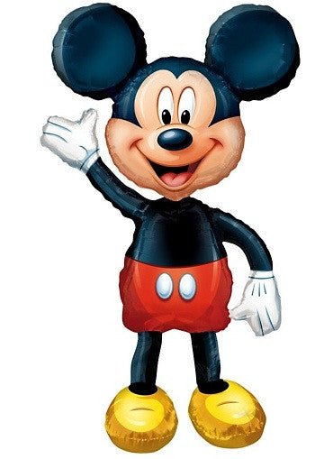 Foil balloon shaped like Mickey Mouse, featuring his classic design with black ears, red shorts with white buttons, yellow shoes, and a waving hand gesture.