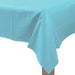 Rectangular table covered with a light blue plastic tablecloth, neatly draped with visible folds hanging over the corner edge of the table.