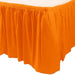 Orange plastic table skirt with gathered pleats attached around the edge of a rectangular table, displayed against a white background.