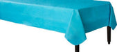 Flannel back Caribbean blue rectangular tablecloth draped neatly over a rectangular table, providing a sleek and elegant appearance suitable for formal events or parties.