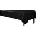 Flannel back black rectangular tablecloth draped neatly over a rectangular table, providing a sleek and elegant appearance suitable for formal events or parties.