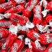 Close-up of Tootsie Frooties Fruit Punch candies – individually wrapped in bright red and white twist wrappers with bold Frooties logo and 'Fruit Punch' flavor text – soft, chewy texture perfect for bulk candy bowls, party favors, and sweet treats.