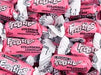 Close-up of individually wrapped Tootsie Frooties Strawberry Lemonade candies – each piece in bright pink and white twist wrapper with bold Frooties logo and 'Strawberry Lemonade' flavor text – soft, chewy candy perfect for party favors, bulk candy jars, and treat bags.