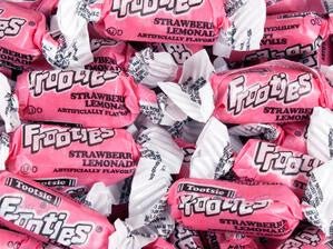 Close-up of individually wrapped Tootsie Frooties Strawberry Lemonade candies – each piece in bright pink and white twist wrapper with bold Frooties logo and 'Strawberry Lemonade' flavor text – soft, chewy candy perfect for party favors, bulk candy jars, and treat bags.