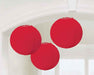 Three round red paper lanterns hanging from the ceiling, each with a ribbed texture and suspended by thin white strings.