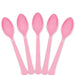Five new pink plastic spoons arranged in a fan shape on a white background.