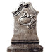 Cut-out of a weathered gray tombstone with a curved top, ornate detailing, and a carved oval centerpiece featuring a horse head and ivy leaves. The stone has a textured, aged appearance with a broad rectangular base.