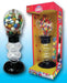 Football-themed gumball bank featuring a clear globe with football stitching detail, filled with multicolored gumballs. It has a spiral dispensing section and a black base. Shown both loose and packaged in a 'Dubble Bubble' retail box labeled 'Football Gumball Bank' with the tagline 'Fun Spiral Action!'.