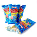 Blue cotton candy bags labeled 'Fluffy Stuff' by Charms, with colorful cotton candy illustrations on the packaging and some cotton candy spilled out in front.
