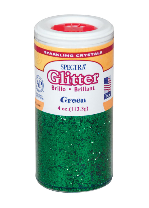 Container of Spectra Sparkling Crystals glitter in green, 4 oz (113.3 g), with a red flip-top lid. The label features the Spectra brand name prominently in red glittery font, includes the word 'Glitter' with translations 'Brillo' and 'Brillant', and indicates the color as 'Green'. It displays an AP seal for non-toxicity, a Made in USA emblem, and a bilingual layout in English, Spanish, and French.